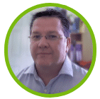 About a man wearing glasses and a blue shirt in a green circle.